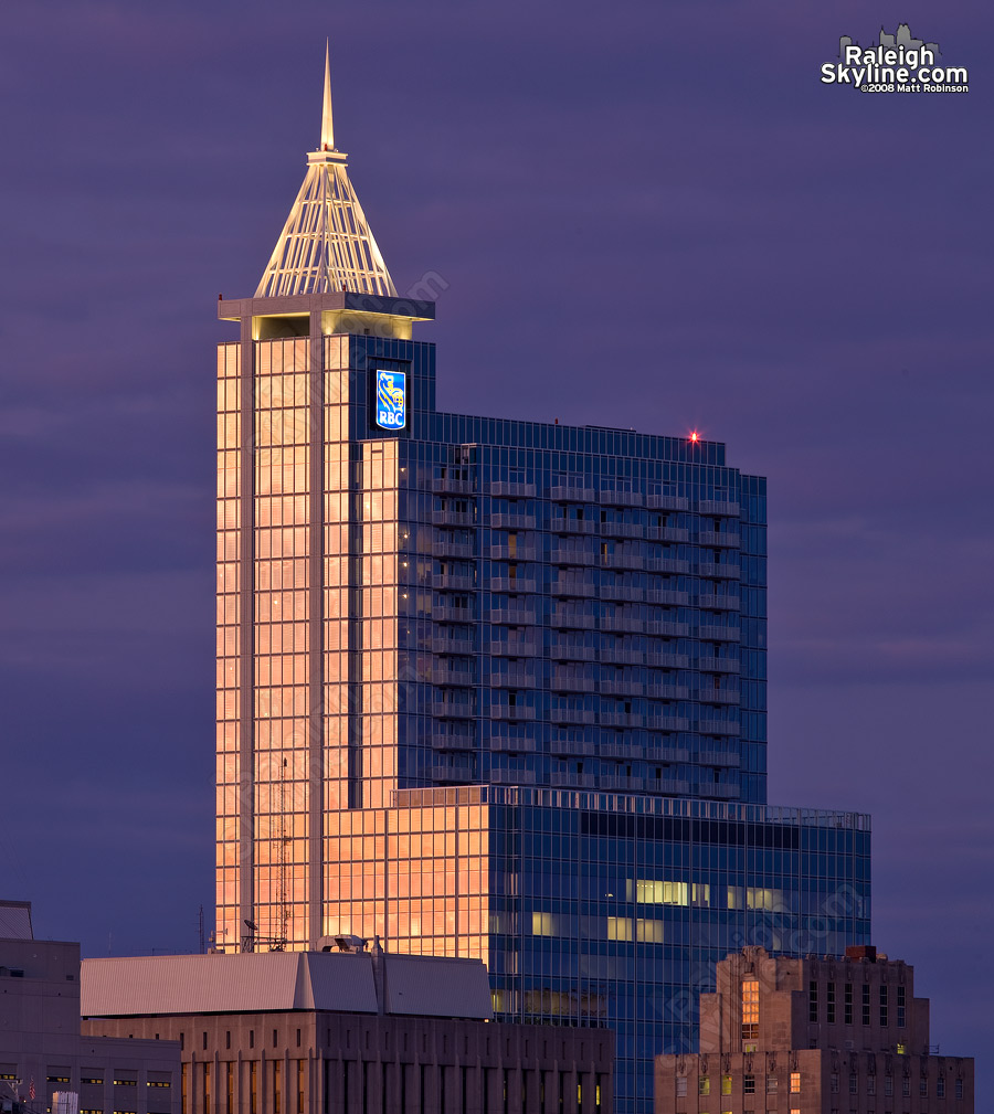 RBC Plaza with the crown illuminated at sunset.